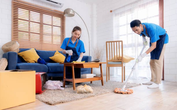 Male and female staff cleaning customers' homes. SEO Services For Cleaning Service